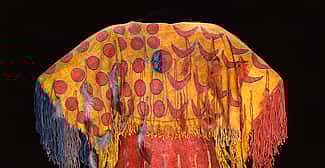 Ghost Dance dress, Southern Arapaho, c. 1890, 54 x 54 inches. Tanned elk hide with numerous pigments, feathers, and fringe. Chandler-Pohrt Collection. Gift of Mary J. and James R. Jundt. NA.204.4 (detail)