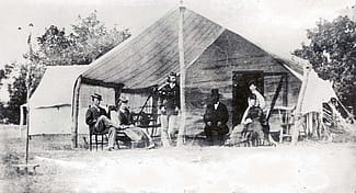 George Armstrong Custer (standing), Libby Custer (second from left) and others on Big Creek, Hays, Kansas, 1867. MS 71 Vincent Mercaldo Collection, McCracken Research Library. P.71.277