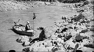 Glass plate negative by Charles J. Belden (1887-1966). Alton Wickwire and Carl Dunrud with the boat "Spirit of the Pitchfork" on the Big Horn River before it was dammed, August 1928. Charles Belden Collection. PN.67.432b (detail)