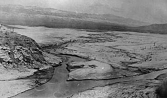 Shoshone Irrigation Company partners hoped the Shoshone River - shown here before the Buffalo Bill Dam - could irrigate lands downstream. Jack Richard Collection. MS 89 Jack Richard Photograph Collection, McCracken Research Library. P.89.88