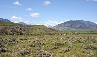 Ken Siggins lives and works on the South Fork, with the Absaroka Range in the background.