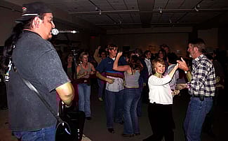 Concert-goers take to the floor to dance during the September 30, 2004, concert at the Center. Chris Gimmeson photo.
