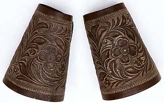 The F.A. Meanea Company of Cheyenne, Wyoming made these cuffs around 1861. Note the refined and detailed appearance of the carving. This is typical of the work done by this firm at that time. 1.69.1486a/b