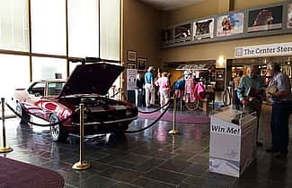 Our two raffle prizes forThis year's raffles, a car and a shotgun, grace our front lobby.