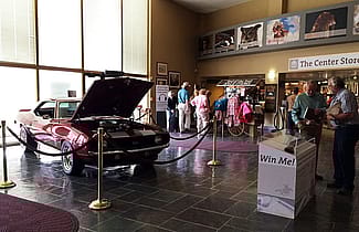 Our two raffle prizes forThis year's raffles, a car and a shotgun, grace our front lobby.
