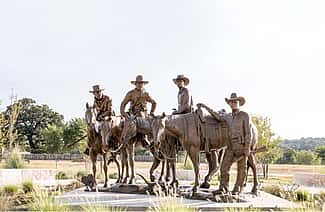 Dustin Payne. "The Legend, The Lore, The Law", 2016. Bronze. Fredericksburg, Texas.
