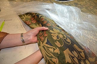 Repair of tapestry by hand sewing