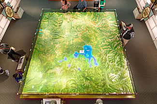 Image looking down on vibrant topographic Park map exhibit at Canyon Visitor Education Center.