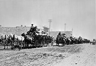 Horse drawn wagons loaded with wool in downtown Cody, Wyoming, 1910. F.J. Hiscock photo. MS 089 Jack Richard Photograph Collection, McCracken Research Library. PN.89.110.21178.04