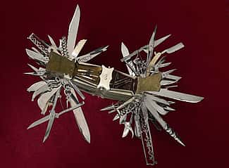 In this view, tortoise shell handle covers are open to reveal the miniature tools contained in the compartments. Multi-bladed folding knife made in Germany ca. 1880 for John S. Holler, cutlery merchant, New York City 1867-1906. Cat. No. 1986.0101.03