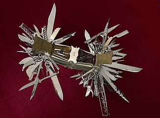 In this view, tortoise shell handle covers are open to reveal the miniature tools contained in the compartments. Multi-bladed folding knife made in Germany ca. 1880 for John S. Holler, cutlery merchant, New York City 1867-1906. Cat. No. 1986.0101.03
