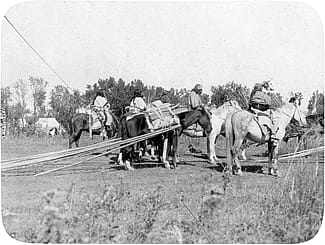 Crow riders dragging tipi poles, early 1900s. MS095 Petzoldt Collection, McCracken Research Library. LS.95.337