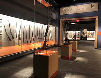 Firearms and the West gallery in the Cody Firearms Museum, with Winchester Factory lintel.