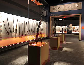 Firearms and the West gallery in the Cody Firearms Museum, with Winchester Factory lintel.