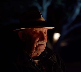 Artist Tony Foster discusses his hopes for the exhibition around the campfire at night. Photograph © TFJ LLC.
