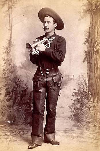 Band leader of Buffalo Bill's Cowboy Band, William Sweeney, in uniform with cornet, ca. 1887. Cabinet photograph. Gift of Mr. and Mrs. George Strobel. P.6.55