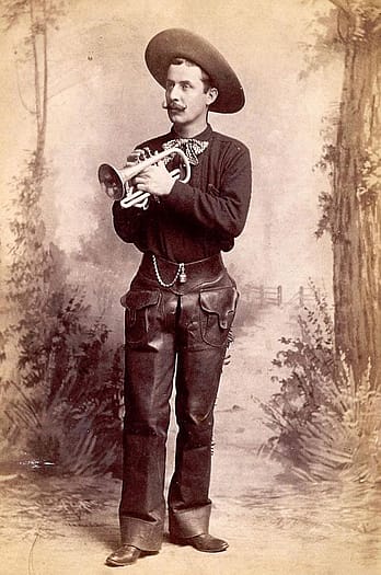 Band leader of Buffalo Bill's Cowboy Band, William Sweeney, in uniform with cornet, ca. 1887. Cabinet photograph. Gift of Mr. and Mrs. George Strobel. P.6.55