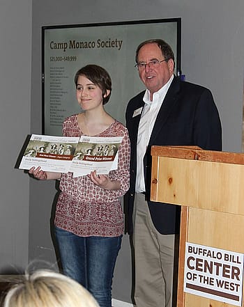 Emily receives her awards from Center Executive Director Bruce Eldredge.
