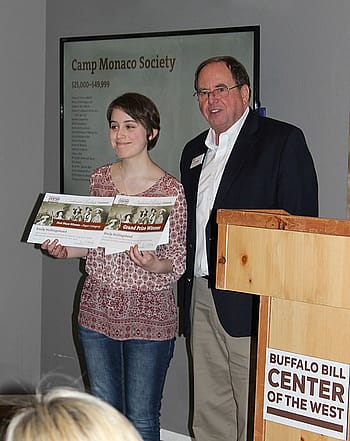 Emily receives her awards from Center Executive Director Bruce Eldredge.