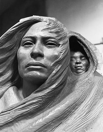 Detail of clay model of Sacajawea and baby.