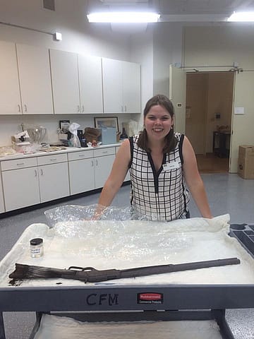 Conservation intern Perrine Le Saux poses with the Great Basin Winchester.