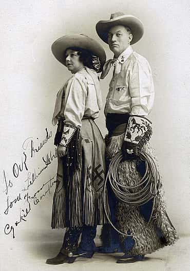 Cy and Lill Compton, ca. 1905. Note swastika on skirt and Native designs on cuffs and gauntlets. Buffalo Bill's Wild West. Gift of Thomas P. Isbell. MS 6 William F. Cody Collection, McCracken Research Library. P.69.1901