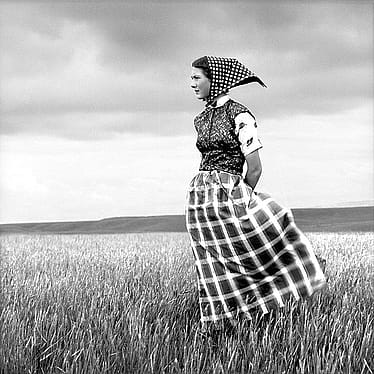 Laura Wilson. Emma, Hutterite Girl in Field, Duncan Ranch Colony Harlowton, Montana, June 17, 1994. Archival pigment print, 46 x 46 in. Private Collection.