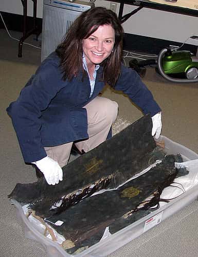 Anne Marie Shriver unpacks a pair of man's leggings.