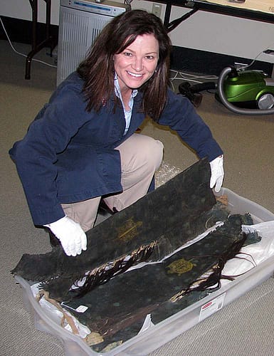 Anne Marie Shriver unpacks a pair of man's leggings.