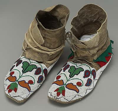 Crow Moccasins, ca. 1885. rawhide, felt, seeds, beads, cloth. NA.202.119