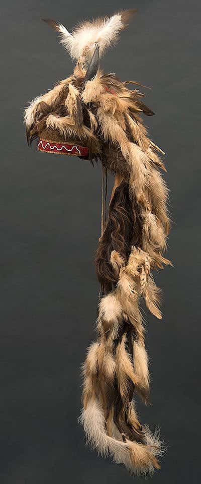 Motokiks Society buffalo horn bonnet including buffalo horns, hide, and hair; golden eagle and hawk feathers. Blackfoot-Kainai, Canada, ca. 1860. Paul Dyck Plains Indian Buffalo Culture Collection. NA.205.109