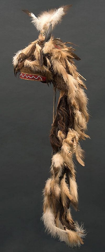 Motokiks Society buffalo horn bonnet including buffalo horns, hide, and hair; golden eagle and hawk feathers. Blackfoot-Kainai, Canada, ca. 1860. Paul Dyck Plains Indian Buffalo Culture Collection. NA.205.109