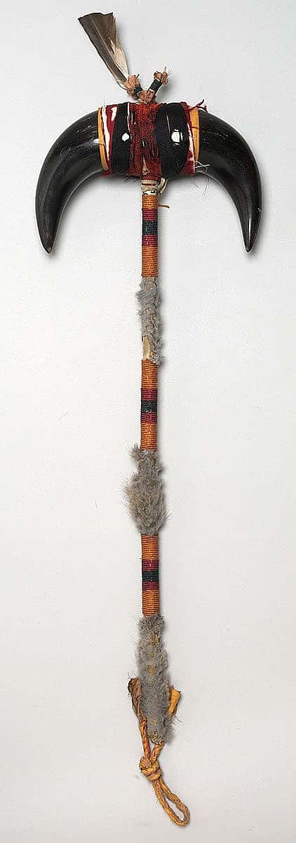 Buffalo horn staff. Northern Plains. Bison horn, cloth, rabbit fur, beads, eagle feather. NA.502.193