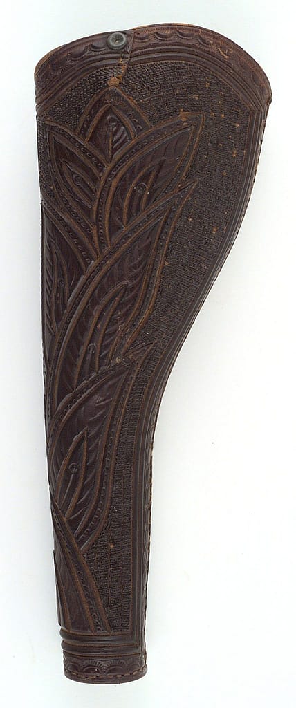 Leather Slim Jim styleholster with tooled leaf and border design, ca. 1860s. Part of the Buffalo Bill Museum collection. 1.69.1823