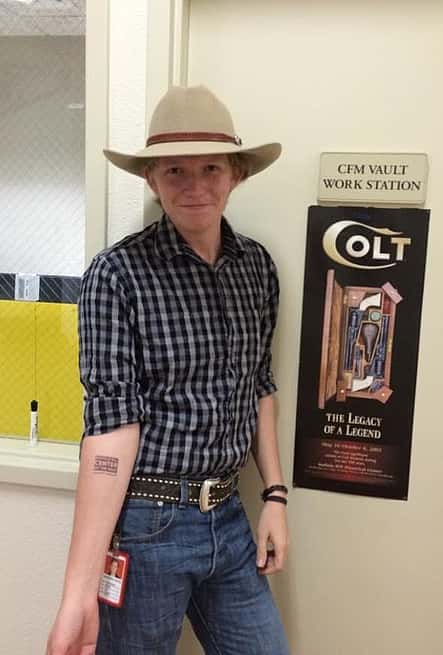 CFM intern Ryan Hodges sports a Center of the West tattoo and his signature wide-brimmed Stetson.