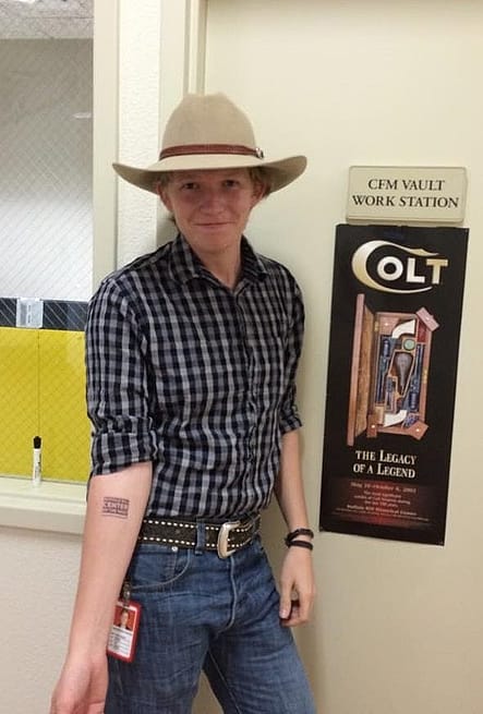 CFM intern Ryan Hodges sports a Center of the West tattoo and his signature wide-brimmed Stetson.