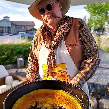 Cooky Rich shows off his delicious cobbler.