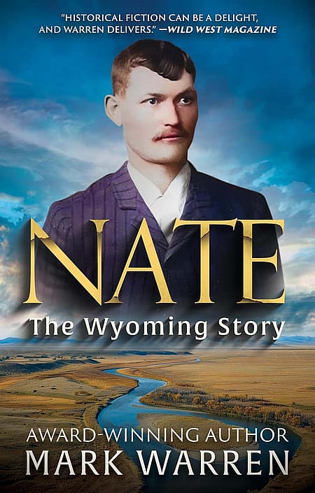 Book cover: "Nate - The Wyoming Story / award-Winning Author Mark Warren" in text, photo of Nate Champion overlaying aerial landscape photo from Johnson County showing river and brown grasses/trees with mountains in background