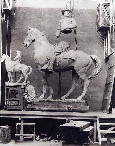 Alexander Phimister Proctor in his studio with the sculpture, Rough Rider, 1922.