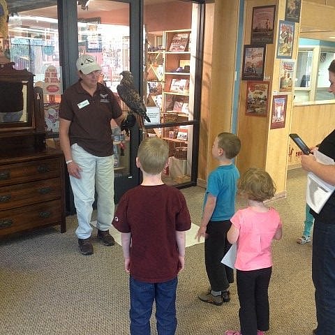 Sally and Isham teaching visitors about red-tailed hawks.