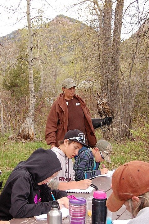 Sally teaching 5th graders about great horned owls during Cody Middle School's "Natural History Days."