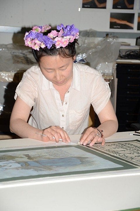Kyoung-eun Park working on paper from Cody Firearms Museum