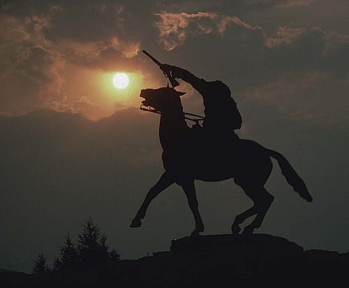 “Buffalo Bill—The Scout” sculpture by Gertrude Vanderbilt Whitney silhouetted in a smokey sky. MS 301 Gabby Barrus Slide Collection, McCracken Research Library. 3.58