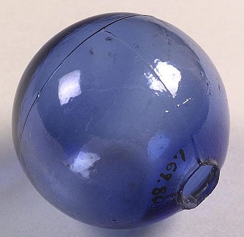 A Treasure from our West: Smooth blue glass target ball. Gift of Alex Kerr. 1.69.80