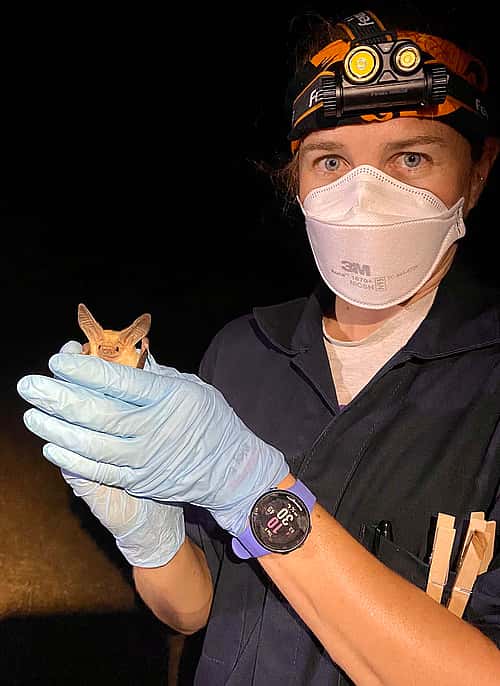 Dr. Riley Bernard holding a bat.