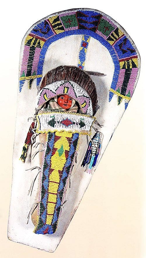 Doll cradle, ca. 1875-1889. Ute, Colorado or Utah. Willow, tanned hide, wood, glass beads. Colorado Historical Society.