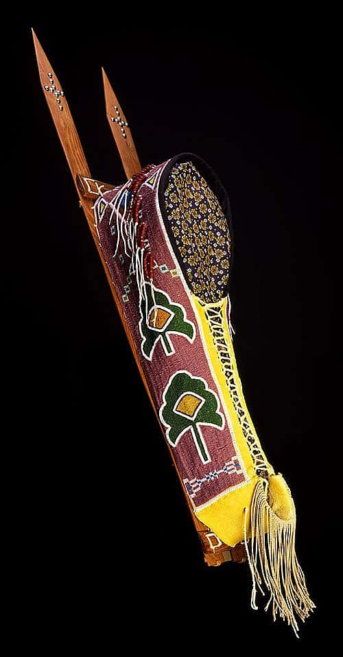 Cradle. Vanessa Paukeigope Jennings, Kiowa and Apache, Fort Cobb, Oklahoma, 1996. Tanned Deerskin, rawhide, glass beads, wood, cotton cloth, metal, and pigments. Museum purchase with funds provided by the Pilot Foundation and Arthur Amiotte. NA.111.59