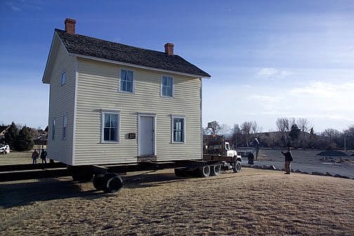 The Boyhood Home on a flatbed, moving the 100 yards to the Greever Garden.