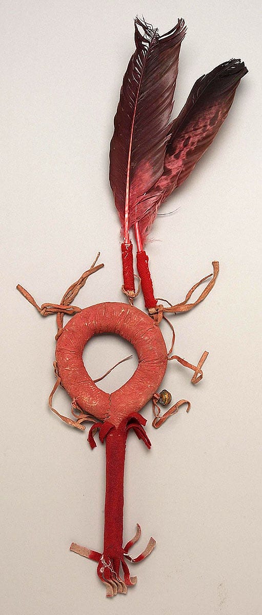 Rattle, Crow. Tradecloth, leather, metal, feathers. Purchased from funds from the Stanley Landgren estate. NA.502.214