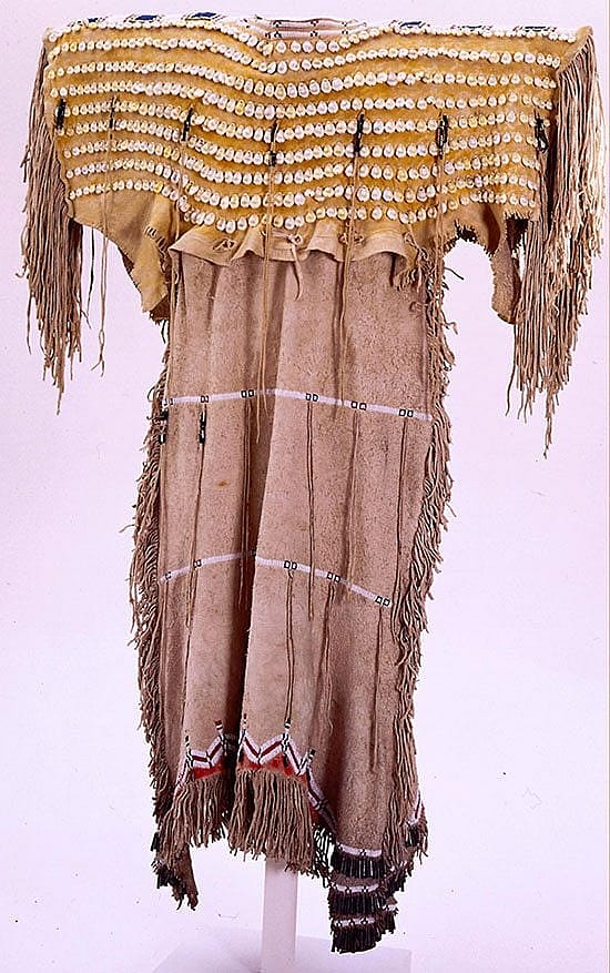 Cheyenne dress with cowrie shell adornment. Chandler-Pohrt Collection, Gift of Mr. William D. Weiss. NA.202.446